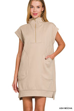 Load image into Gallery viewer, Woman wearing a beige sleeveless dress with a zipper on a white background