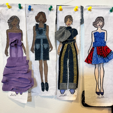 Load image into Gallery viewer, Four paper fashion dolls with different outfits pinned to a board.
